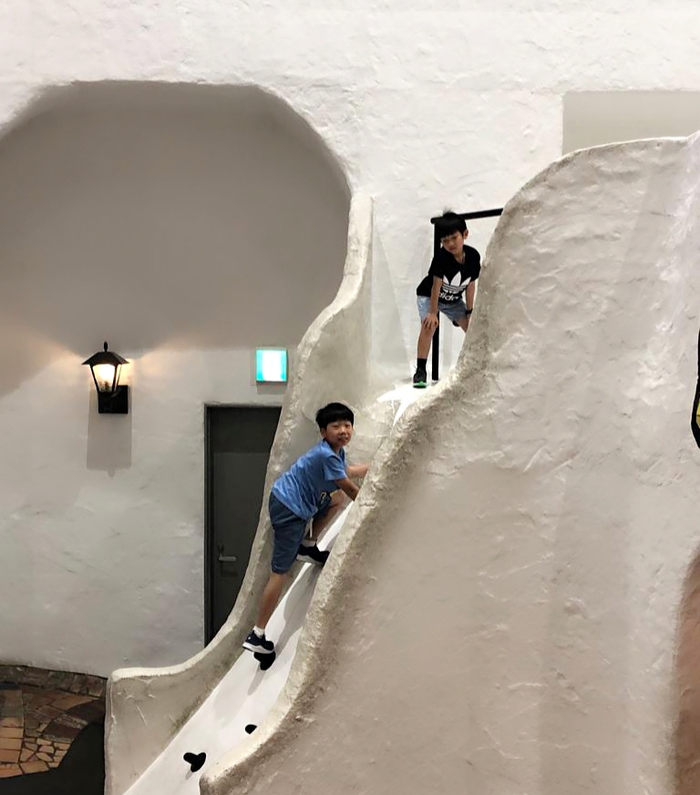 2 young boys rock climbing at Osaka Kids Plaza