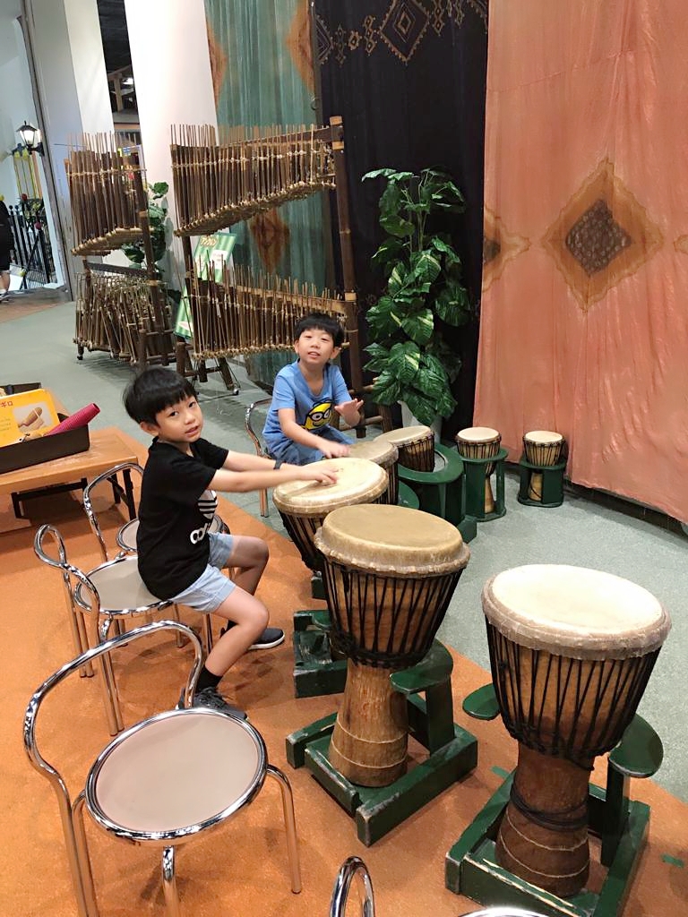 2 young boys playing percussion drums at Osaka Kids Plaza