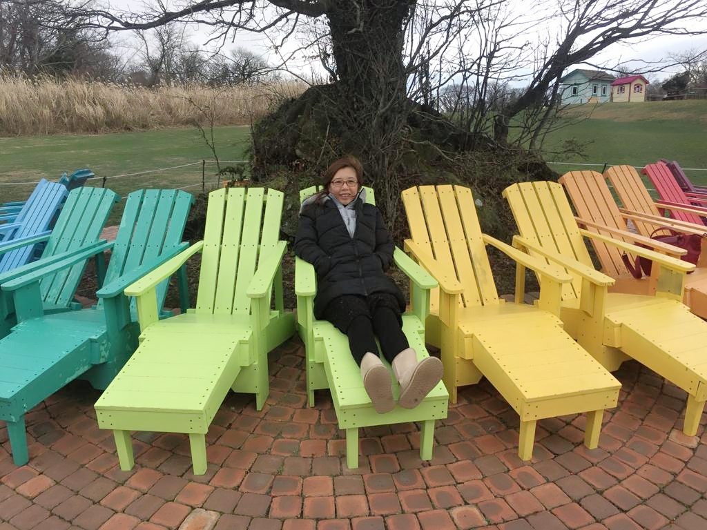 Family photo at EcoLand Jeju colourful recliner chairs