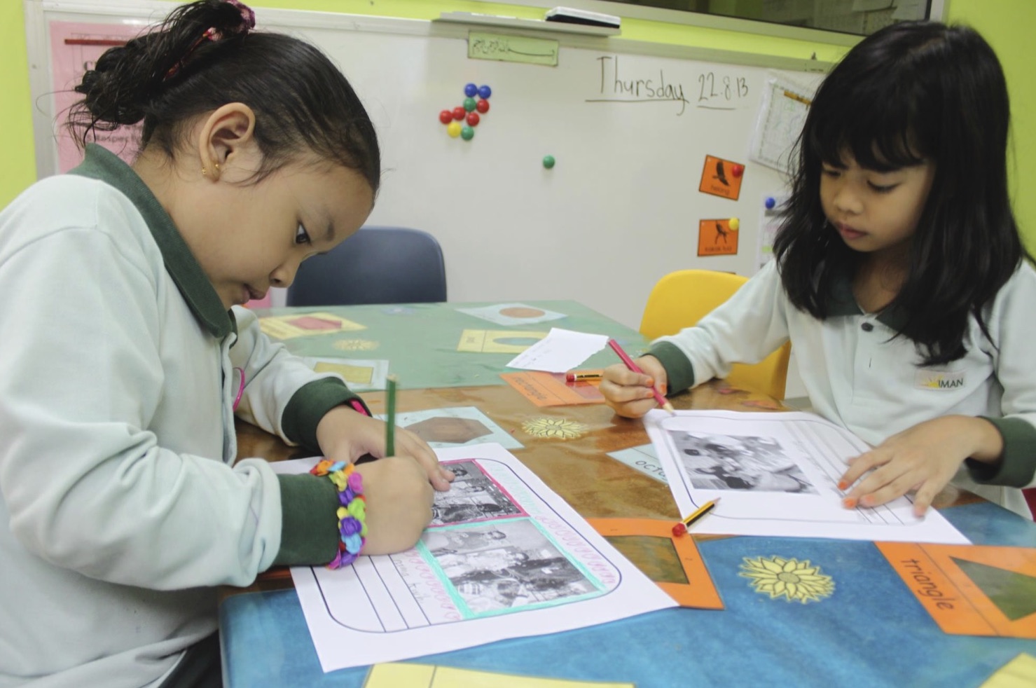 IMAN Kindergarten 2 young girls learning malay