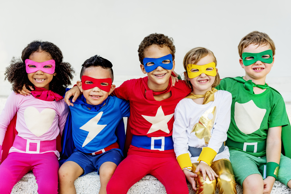 5 children dressed as superheroes