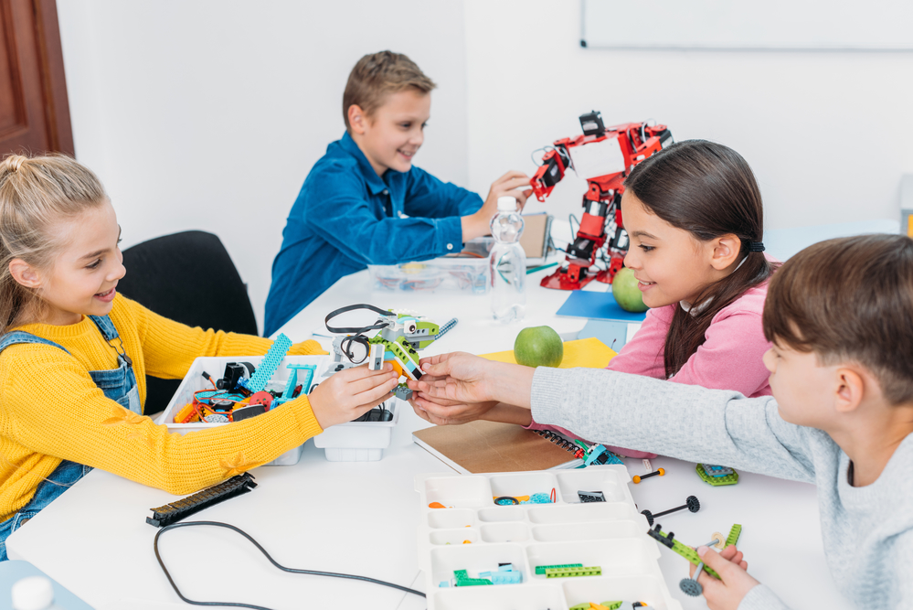 4 students in denmark making science figurines