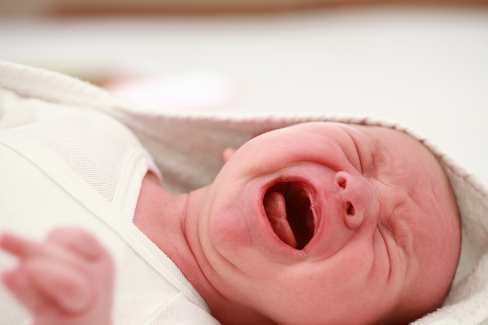 newborn baby crying from colic