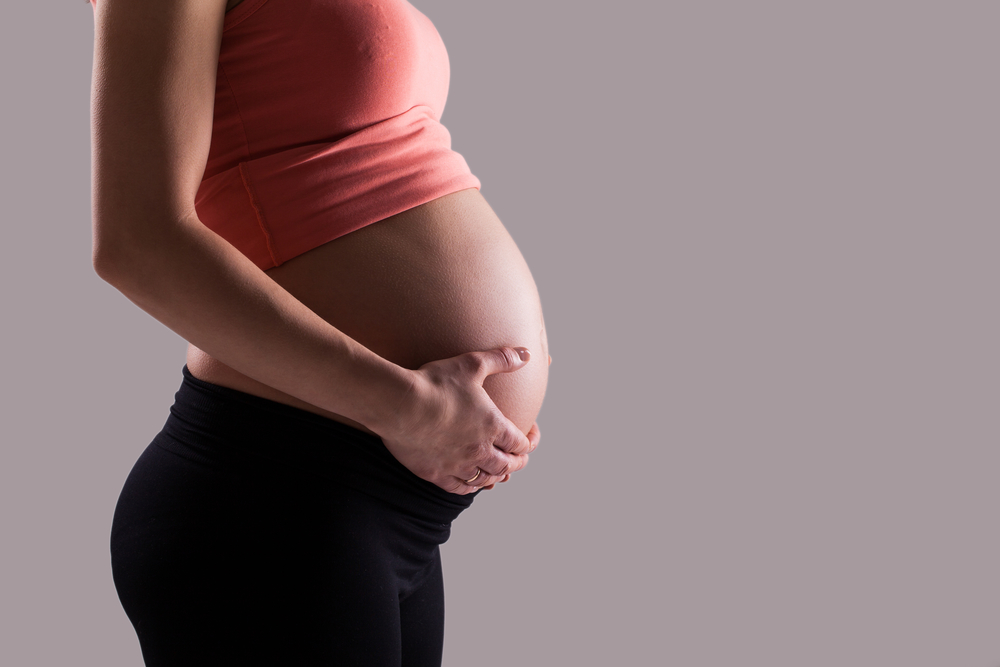 pregnancy week 10 woman side profile