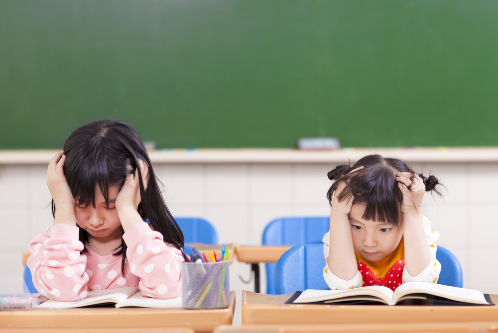 2 girl children studying exam stress