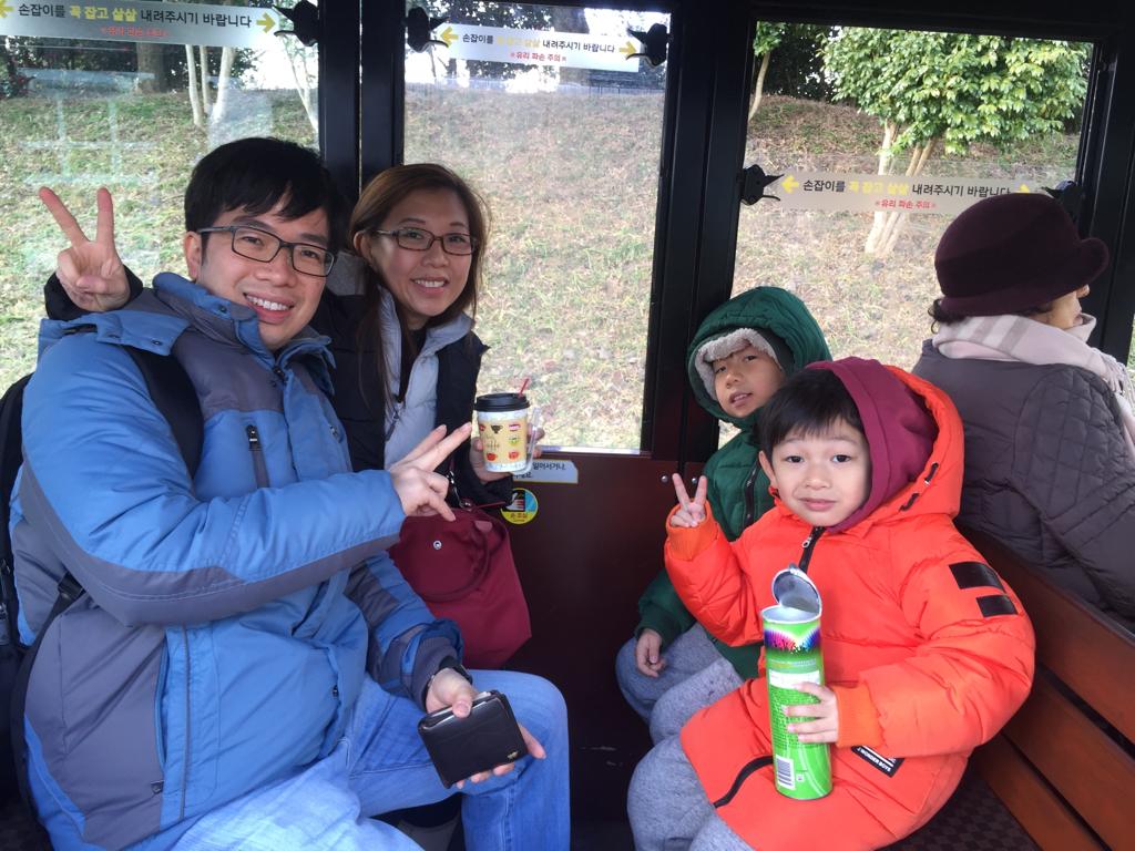 Family photo while riding in Ecoland Jeju train